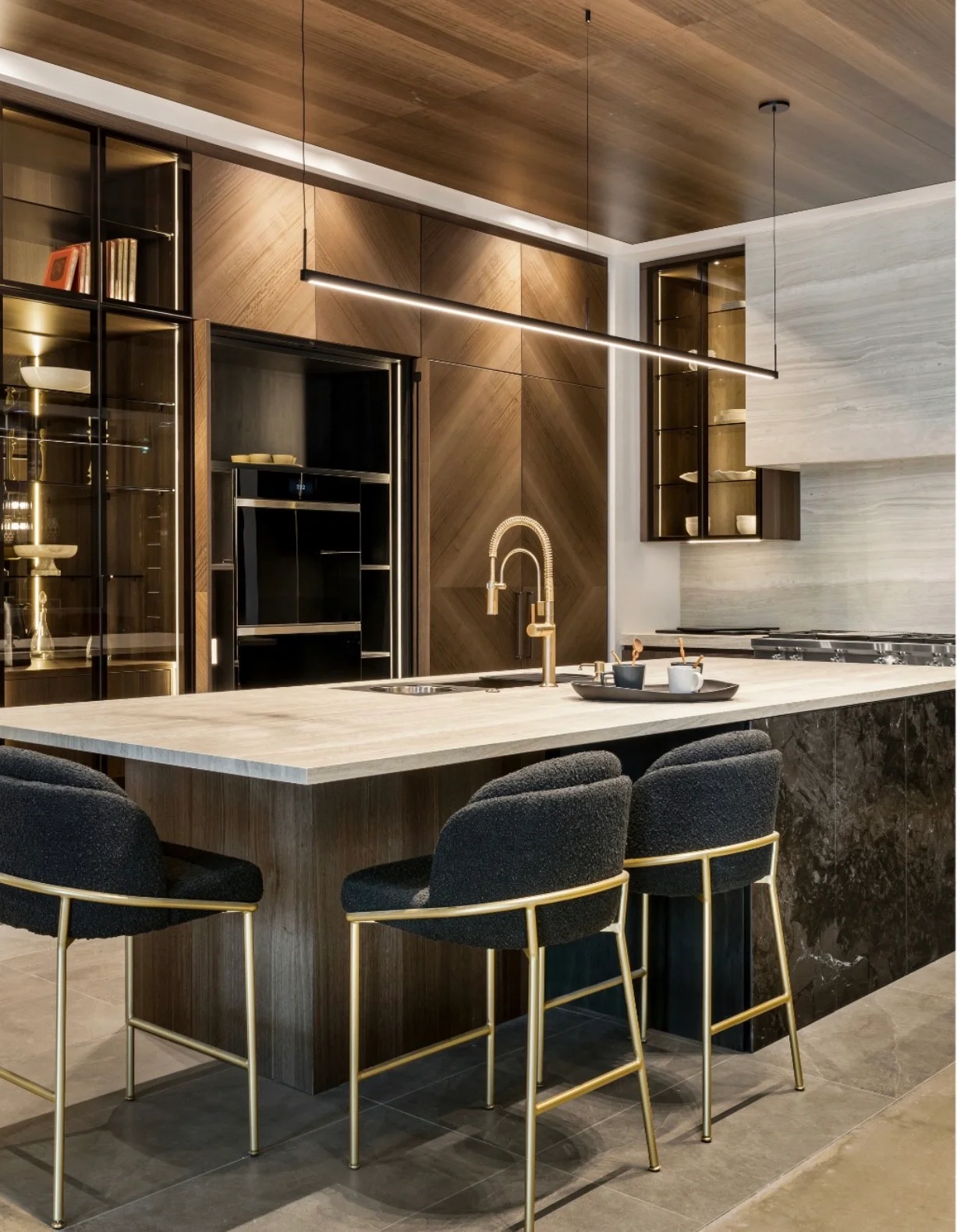 Modern kitchen with wood cabinetry, quartz countertop, and brass fixtures
