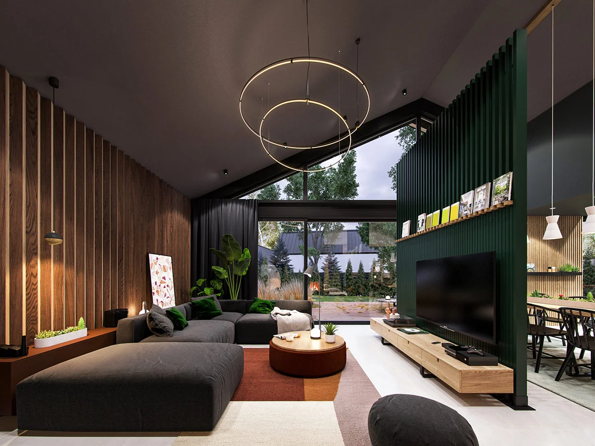 Modern living room with wood paneling, green metal accent wall, and open kitchen concept